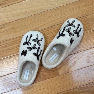 Women's Cream Slippers with Black Bow Design